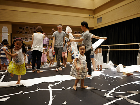 Children and This and That performers playing on stage together