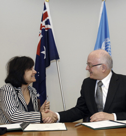 Photo of Ines Alberdi shakes hand with Bob McMullan