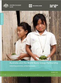 Report cover: AusAID crest, The World Bank and Audstralian Aid identifier logos above a photo of two girls from Laos standing together holding bowls of food.