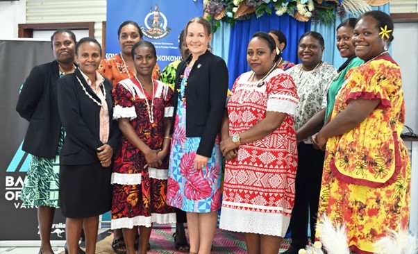 Women in bright clothing standing together