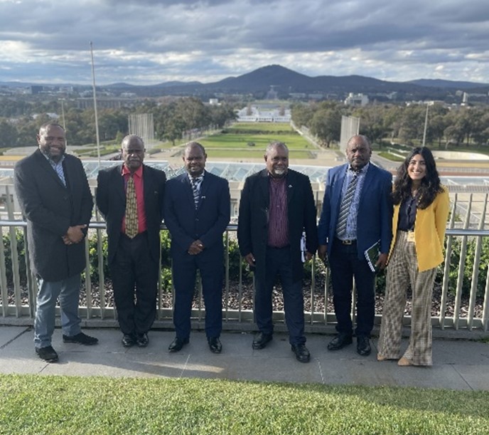 Six CFP delegates from Vanuatu standing outside the Australian Parliament House, Canberra.